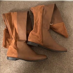 Knee high cognac boots.